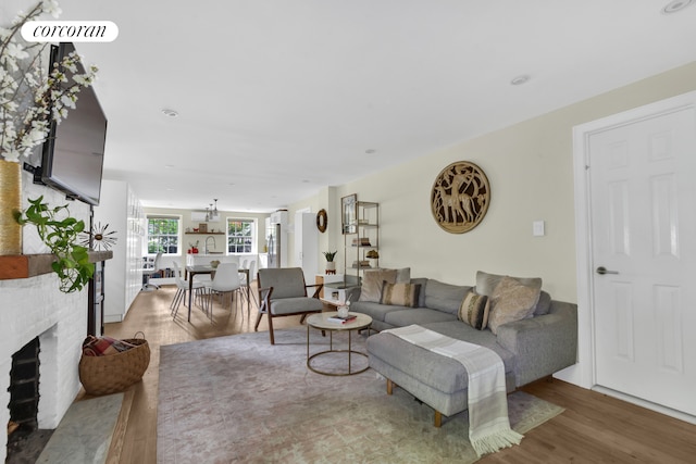 89 State St Unit 1, New York City, NY 11201 - living room featuring a fireplace and wood finished floors