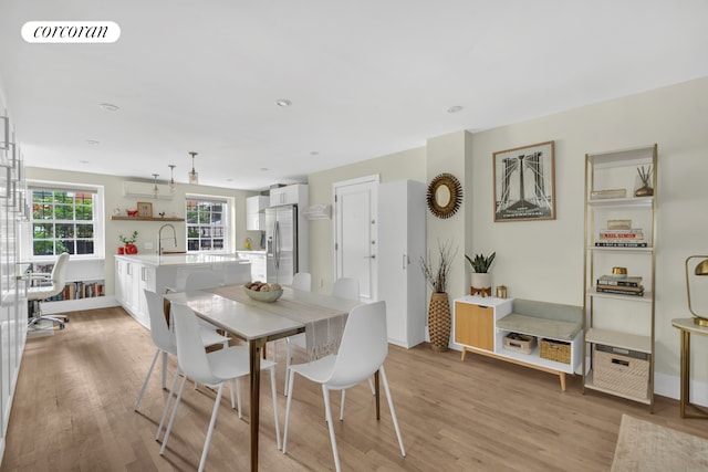 89 State St Unit 1, New York City, NY 11201 - dining area with light wood-style flooring and baseboards