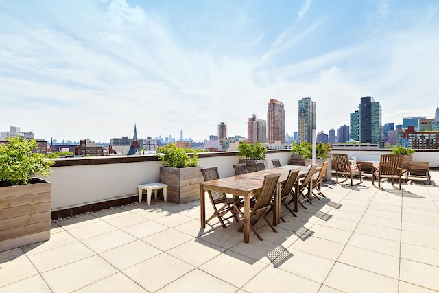 10-55 47th Ave Unit 7-F, New York City, NY 11101 - view of patio with a skyline view and outdoor dining space
