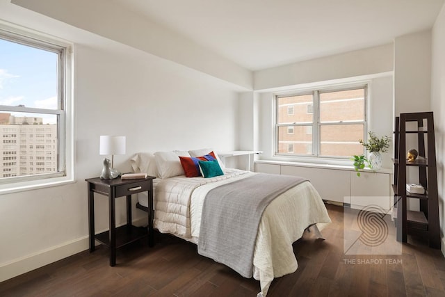 165 W 66th St Unit 21Ef, New York City, NY 10023 - bedroom with dark wood-style flooring and baseboards