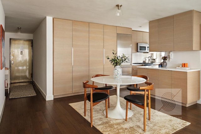 165 W 66th St Unit 21Ef, New York City, NY 10023 - dining area featuring dark wood-type flooring and baseboards