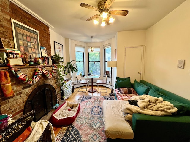 298 12th St Unit 2F, New York City, NY 11215 - living area with a ceiling fan, wood finished floors, and a brick fireplace