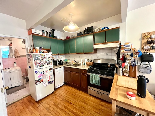 298 12th St Unit 2F, New York City, NY 11215 - kitchen featuring stainless steel appliances, under cabinet range hood, light wood finished floors, and decorative backsplash