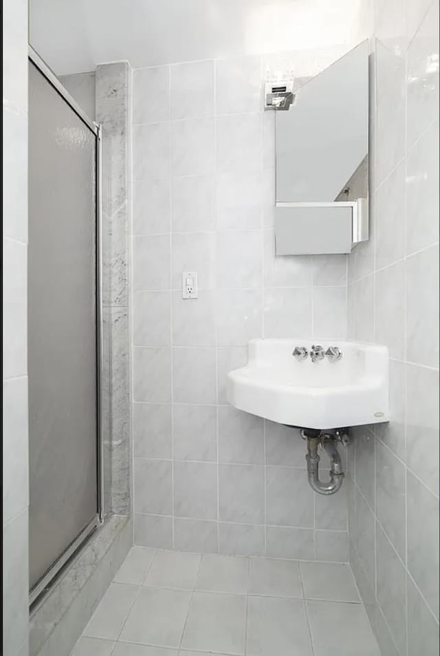 367 Carlton Ave, New York City, NY 11238 - bathroom featuring a shower stall and tile patterned flooring
