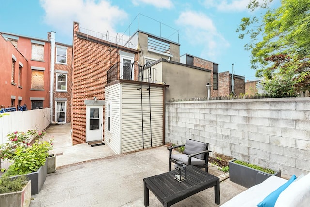 367 Carlton Ave, New York City, NY 11238 - fenced backyard featuring a patio area and an outdoor living space