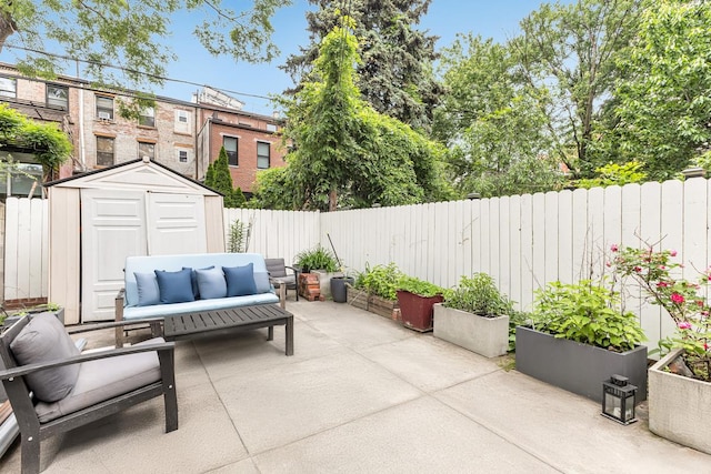 367 Carlton Ave, New York City, NY 11238 - fenced backyard featuring a patio area, a storage unit, and outdoor lounge area