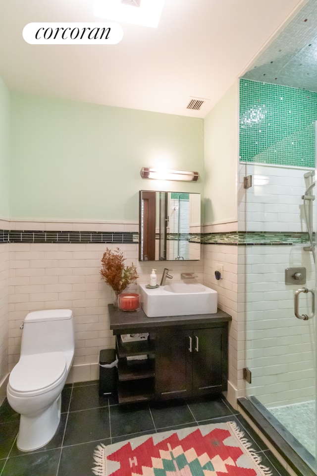 17 Murray St Unit 4Fl, New York City, NY 10007 - bathroom featuring tile walls, vanity, tile patterned flooring, a shower stall, and toilet