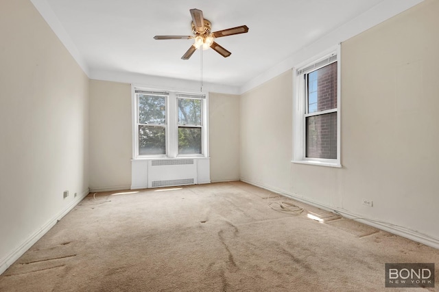 3321 Bruckner Blvd Unit 2D, New York City, NY 10461 - carpeted empty room with radiator heating unit, ceiling fan, and baseboards