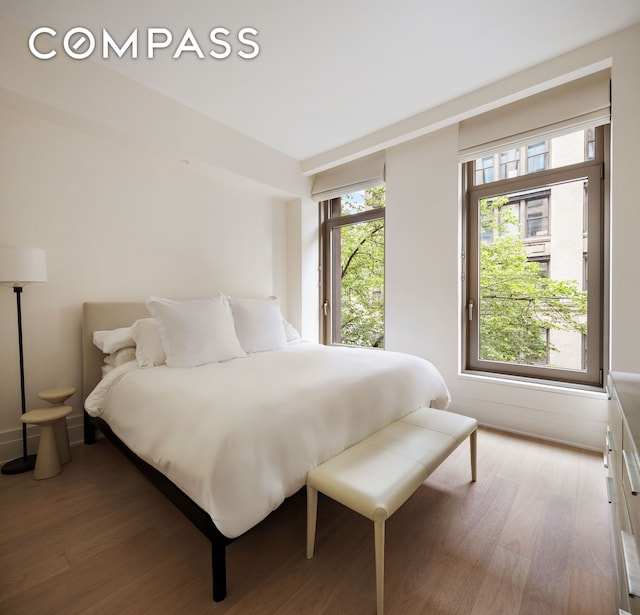 40 Bleecker St Unit 3E, New York City, NY 10012 - bedroom featuring wood finished floors