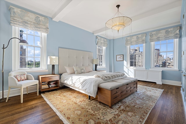 14 E 75th St Unit 10D, New York City, NY 10021 - bedroom with dark wood-type flooring, beam ceiling, baseboards, and a city view
