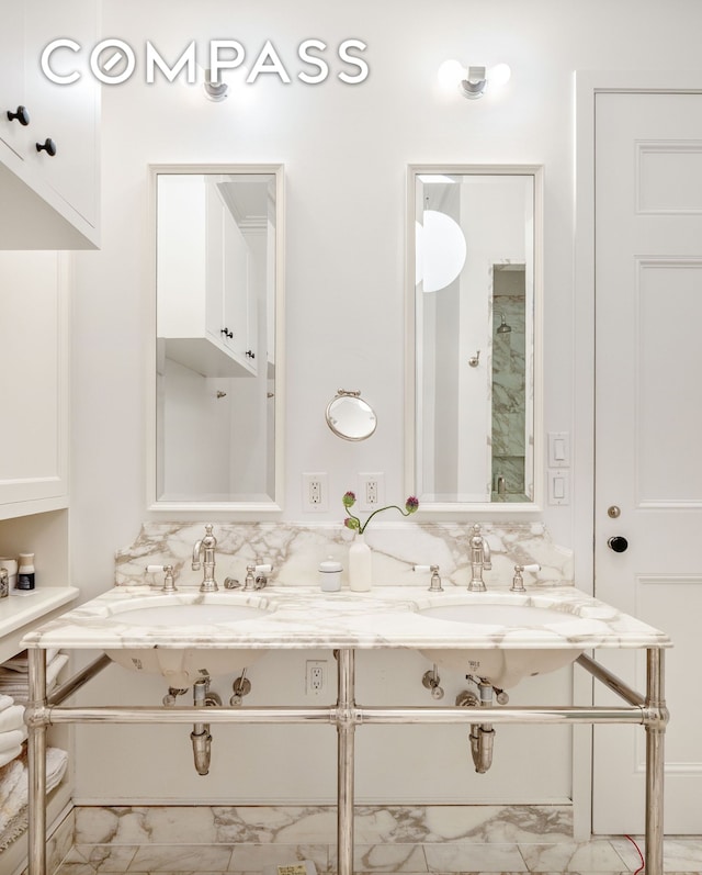 9 W 16th St Unit 3, New York City, NY 10011 - full bathroom featuring marble look tile flooring and double vanity