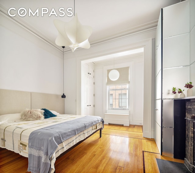 9 W 16th St Unit 3, New York City, NY 10011 - bedroom with hardwood / wood-style flooring and crown molding