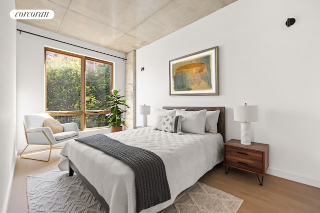 1118 Fulton St Unit 5F, New York City, NY 11238 - bedroom featuring wood finished floors and baseboards