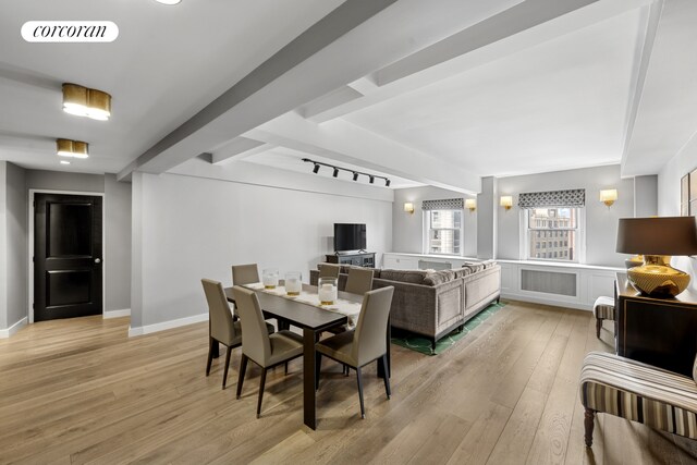 2166 Broadway Unit 7B, New York City, NY 10024 - dining space featuring beam ceiling and light wood-style floors