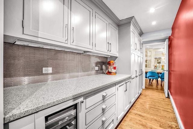 400 W End Ave Unit 6B, New York City, NY 10024 - kitchen featuring light wood finished floors, tasteful backsplash, light stone countertops, baseboards, and recessed lighting