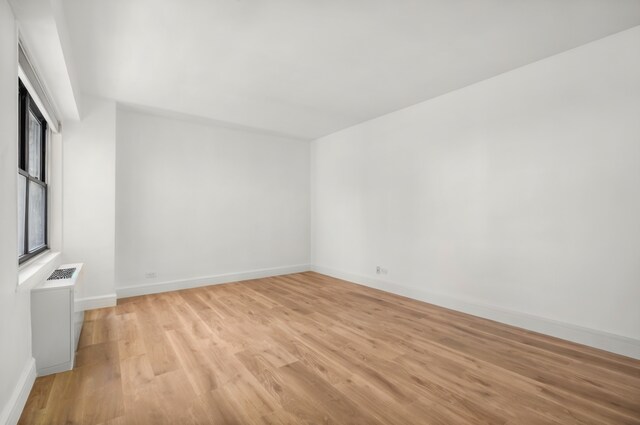 400 E 56th St Unit 31J, New York City, NY 10022 - empty room with light wood-type flooring and baseboards