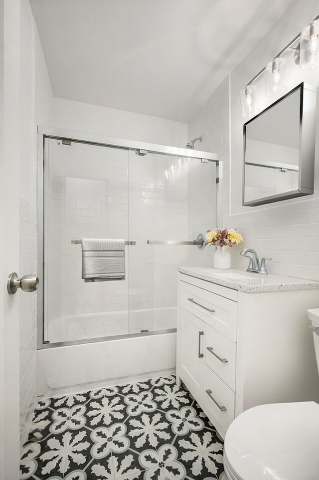 400 E 56th St Unit 31J, New York City, NY 10022 - full bathroom with vanity and enclosed tub / shower combo