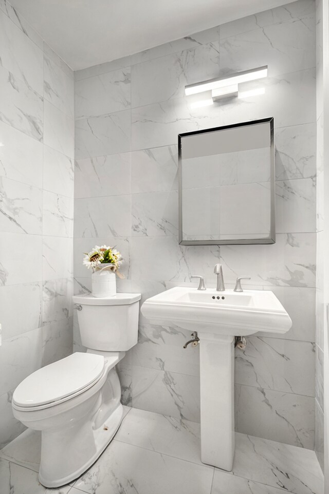 400 E 56th St Unit 31J, New York City, NY 10022 - half bathroom featuring marble finish floors