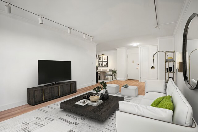 400 E 56th St Unit 31J, New York City, NY 10022 - living area featuring track lighting, wood finished floors, and arched walkways