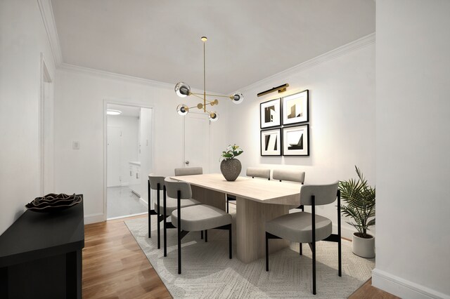 400 E 56th St Unit 31J, New York City, NY 10022 - dining space with crown molding and wood finished floors