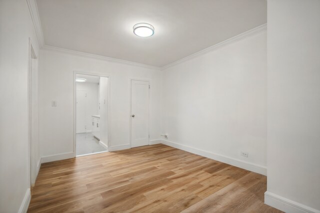 400 E 56th St Unit 31J, New York City, NY 10022 - empty room with crown molding and light wood-style floors