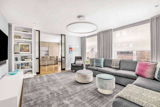 21 W 20th St Unit Ph1, New York City, NY 10011 - living room featuring plenty of natural light and wood finished floors