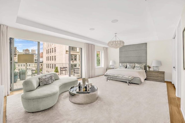 21 W 20th St Unit Ph1, New York City, NY 10011 - bedroom featuring access to exterior, a chandelier, and wood finished floors