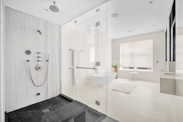 21 W 20th St Unit Ph1, New York City, NY 10011 - full bathroom with a shower stall, vanity, a freestanding bath, and tile patterned flooring