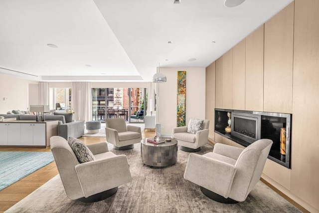 21 W 20th St Unit Ph1, New York City, NY 10011 - living area featuring wood finished floors and a fireplace with raised hearth