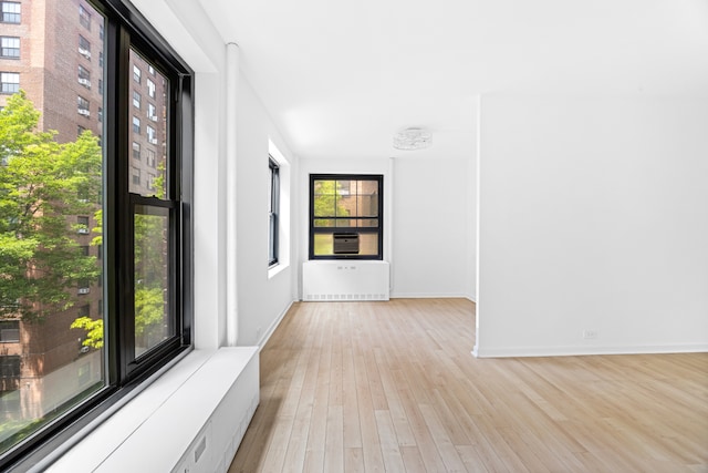 365 Clinton Ave Unit 6F, New York City, NY 11238 - spare room with light wood finished floors and radiator
