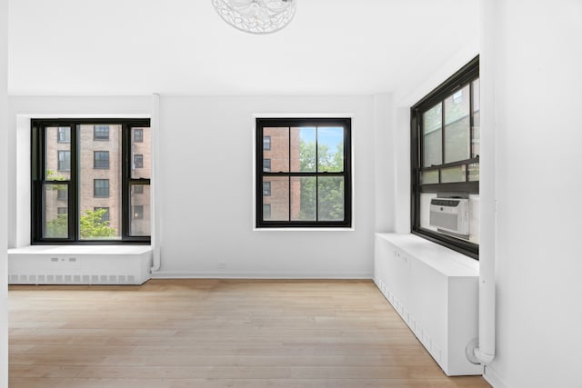 365 Clinton Ave Unit 6F, New York City, NY 11238 - spare room with wood finished floors and cooling unit