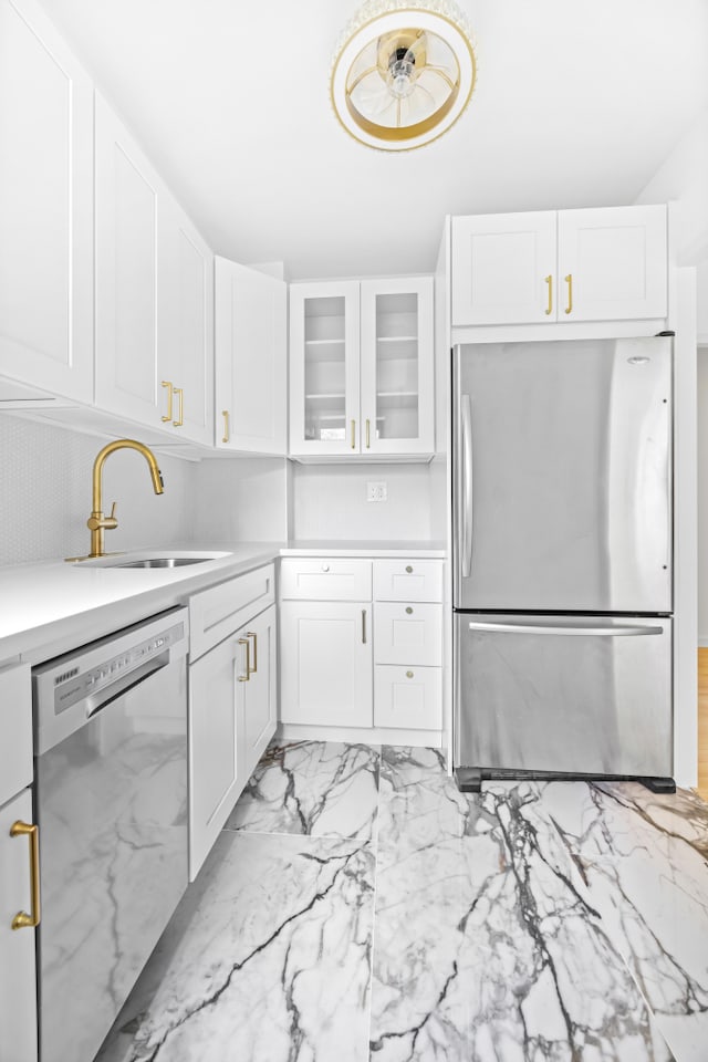 365 Clinton Ave Unit 6F, New York City, NY 11238 - kitchen with appliances with stainless steel finishes, white cabinetry, light countertops, glass insert cabinets, and light marble finish floors