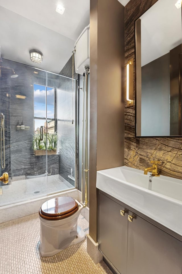 105 E 15th St Unit 106, New York City, NY 10003 - full bathroom with toilet, vanity, a shower stall, and tile patterned floors