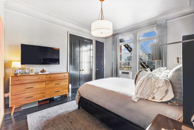 105 E 15th St Unit 106, New York City, NY 10003 - bedroom featuring crown molding, dark wood-style flooring, and cooling unit