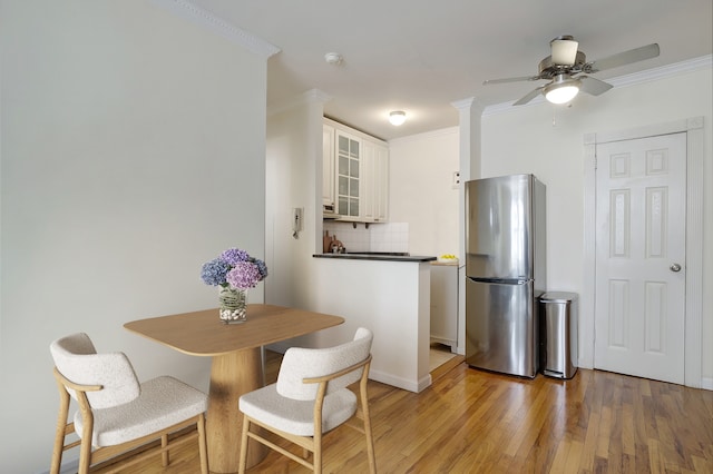 229 E 29th St Unit E-3, New York City, NY 10016 - dining area with ornamental molding, light wood-type flooring, a ceiling fan, and baseboards