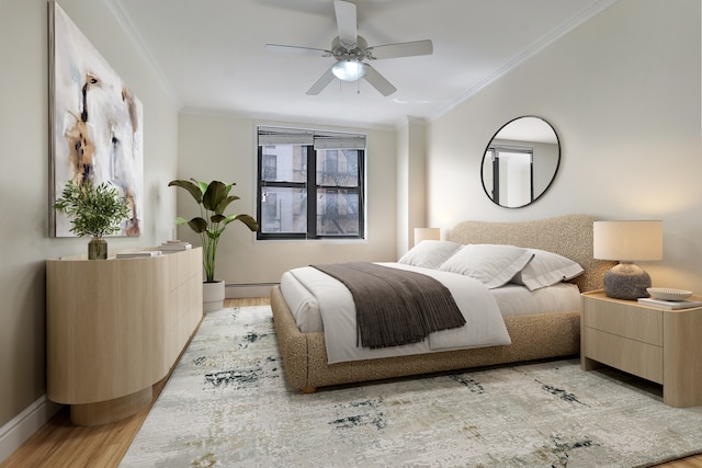 229 E 29th St Unit E-3, New York City, NY 10016 - bedroom with crown molding, light wood-style flooring, a baseboard radiator, baseboards, and a ceiling fan