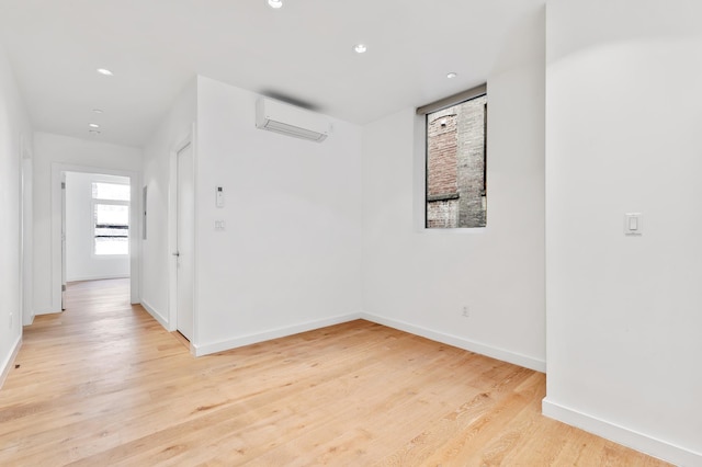 241 W 107th St Unit 2-Flr, New York City, NY 10025 - empty room with an AC wall unit, recessed lighting, light wood-type flooring, and baseboards