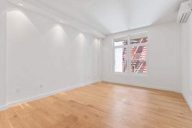 241 W 107th St Unit 2-Flr, New York City, NY 10025 - spare room with a wall mounted AC, light wood-style floors, baseboards, and recessed lighting
