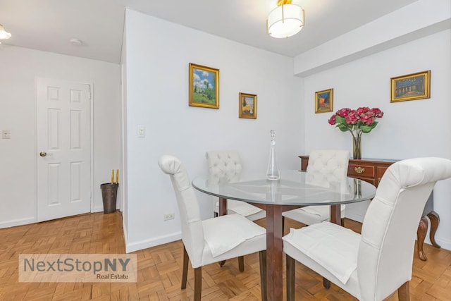 411 E 57th St Unit 2E, New York City, NY 10022 - dining room with baseboards