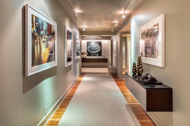 43 W 64th St Unit 6A, New York City, NY 10023 - corridor with wood finished floors and rail lighting