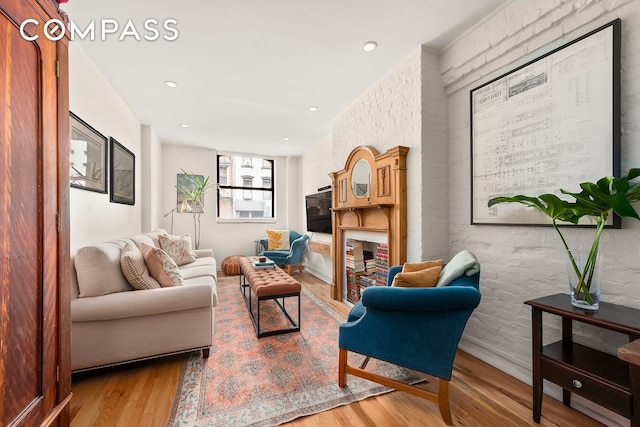 334 E 5th St Unit 2, New York City, NY 10003 - living room featuring wood finished floors and recessed lighting