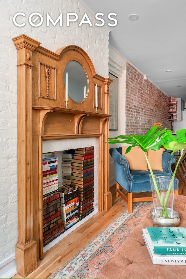 334 E 5th St Unit 2, New York City, NY 10003 - detailed view of wood finished floors and brick wall