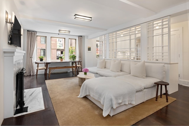 59 W 12th St Unit 4A, New York City, NY 10011 - bedroom featuring dark wood-style flooring and a fireplace