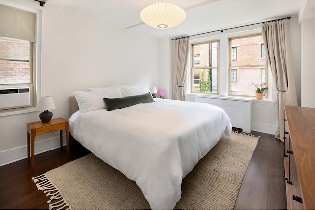 59 W 12th St Unit 4A, New York City, NY 10011 - bedroom with dark wood-style flooring, baseboards, and cooling unit