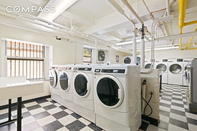 433 W 34th St Unit 8D, New York City, NY 10001 - shared laundry room with tile patterned floors and independent washer and dryer