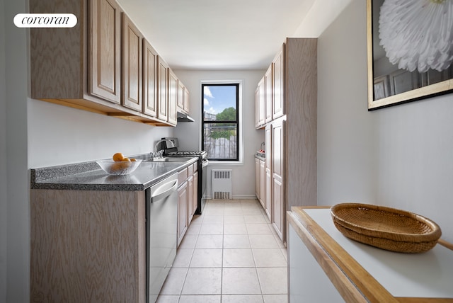 202 Seeley St Unit 2E, New York City, NY 11218 - kitchen featuring stainless steel dishwasher, radiator heating unit, under cabinet range hood, dark countertops, and light tile patterned floors