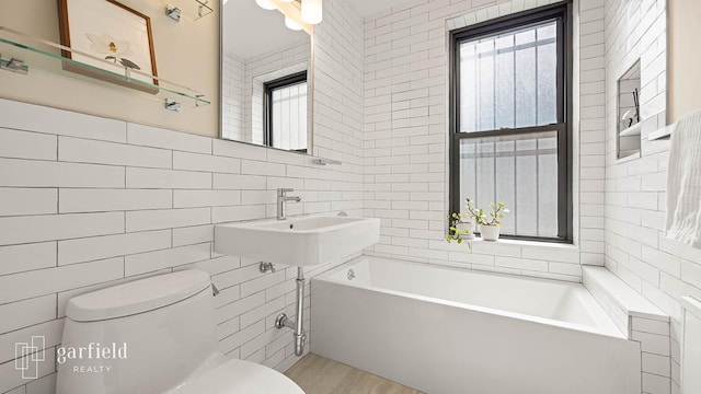 20 Plaza St E Unit A-8, New York City, NY 11238 - full bath featuring tile walls, toilet, a bathtub, and a sink