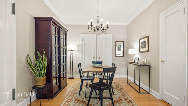 20 Plaza St E Unit A-8, New York City, NY 11238 - dining room with a chandelier, light wood-type flooring, ornamental molding, and baseboards