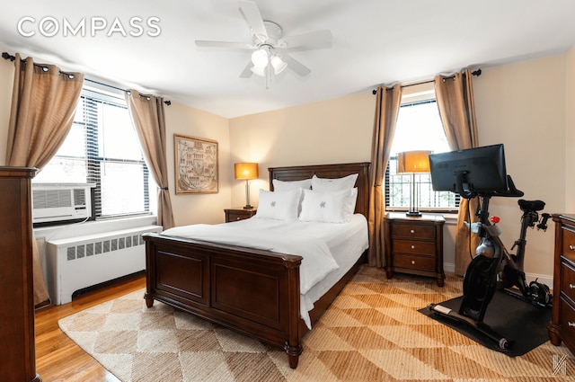 22-40 80th St Unit 3B, New York City, NY 11370 - bedroom with radiator, light wood-style floors, a ceiling fan, and cooling unit