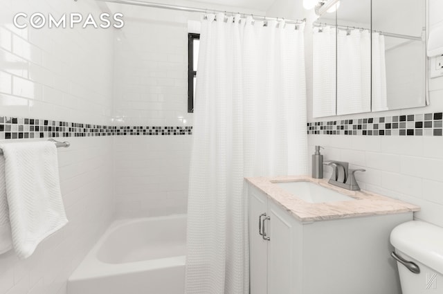 22-40 80th St Unit 3B, New York City, NY 11370 - bathroom featuring tile walls, toilet, shower / tub combo, and vanity